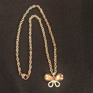 Gold colored necklace with sparkly butterfly pendant. Great necklace for Spring!